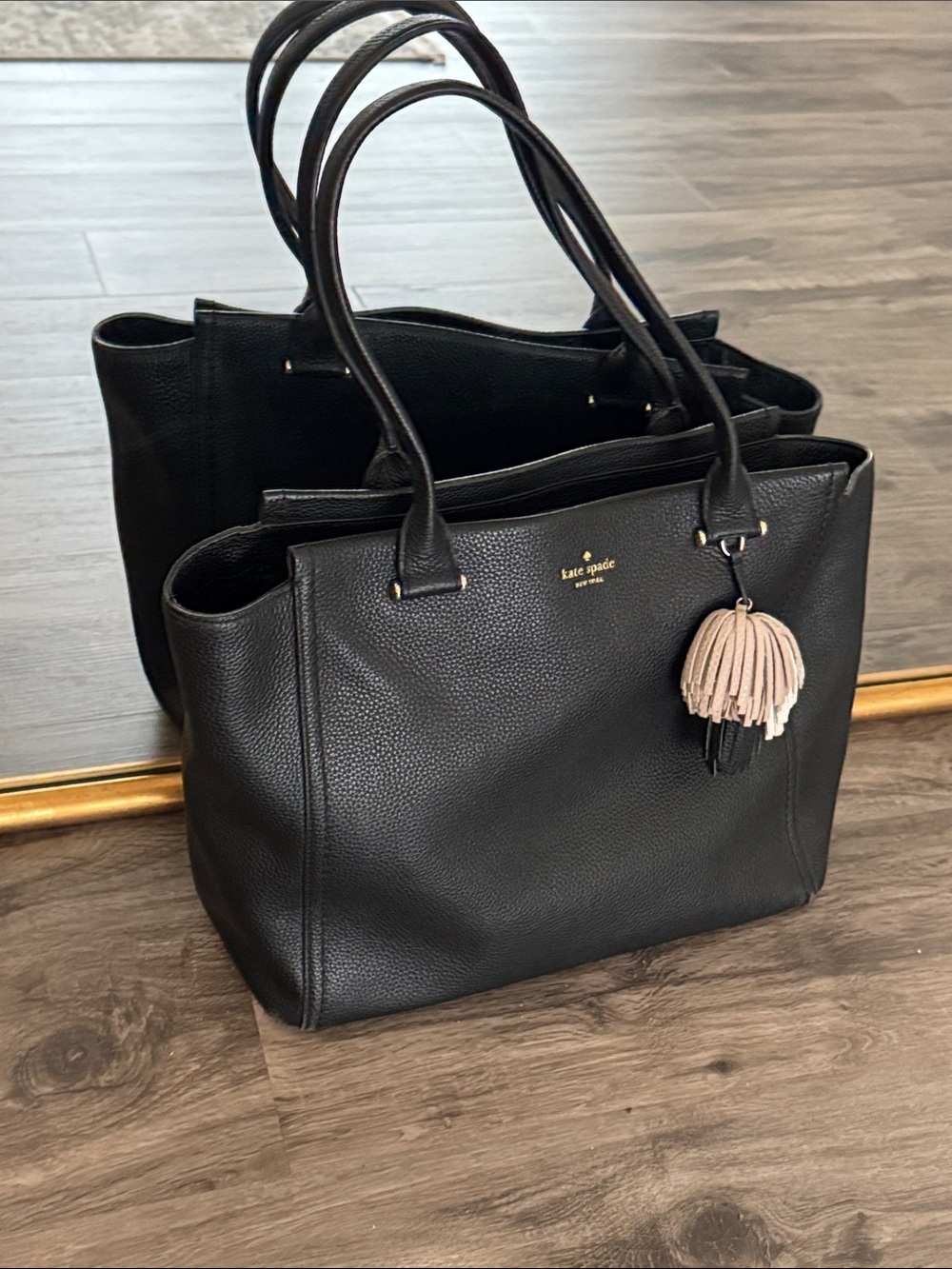 kate spade Black Pebbled Leather Tote with Pink Tassel Charm